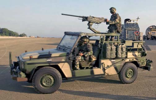 060730-N-9851B-003 (Jul. 30, 2006) Paratroopers, 9th Royal Malay Regiment (RMR), drive a Mercedes Benz Gwagen GD290 assault vehicle mounted with an M2 .50 caliber machine gun, from Landing Craft Air-Cushion 73 (LCAC-73), during an amphibious assault, in support of Exercise Cooperation Afloat Readiness and Training (CARAT) at Pahang, Malaysia (MYS). U.S. Navy official photo by Mass Communication Specialist Second Class John L. Beeman (Released)