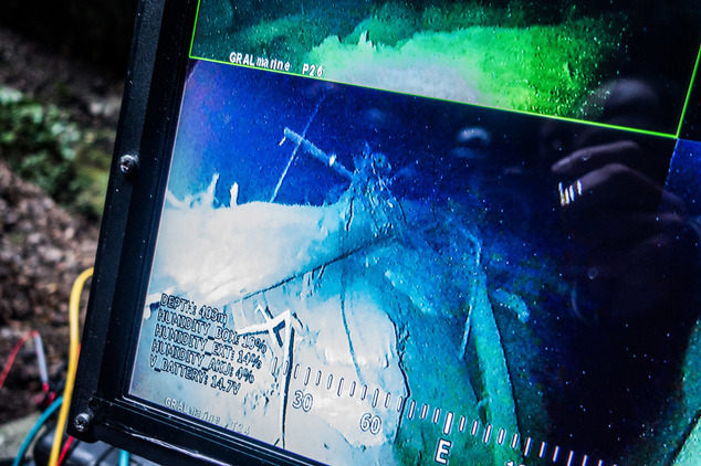 In this photo taken Sept. 27, 2016 in the flooded Hranicka Propast, or Hranice Abyss, in the Czech Republic is pictured the screen of a remotely-operate underwater robot, or ROV, indicating it has reached the depth of 403 meters (1322.18 feet) in the cave, revealing it to be the world's deepest known flooded limestone sinkhole, during an expedition led by Polish explorer Krzysztof Starnawski. The robot went to the depths of 404 meters, the length of its cord, but appeared not to have reached the bottom,,during the 'Hranicka Propast - step beyond 400m' expedition that was partly funded by the National Geographic. (Krzysztof Starnawski Expedition via AP)