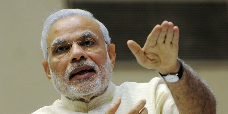 Indian Prime Minister Narendra Modi gestures as he addresses a ceremony at the launch of "Smart Cities Mission, Atal Mission for Rejuvenation and Urban Transformation (AMRUT)' in New Delhi on June 25, 2015. AFP PHOTO/STR (Photo credit should read STRDEL/AFP/Getty Images)