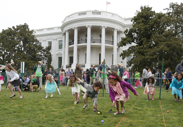 WASHINGTON, DC - APRIL 01: Children roll eggs during the annual Easter Egg Roll at the White House April 1, 2013 in Washington, DC. Thousands of people are expected to attend the 134-year-old tradition of rolling colored eggs down the White House lawn that was started by President Rutherford B. Hayes in 1878. (Photo by Mark Wilson/Getty Images)