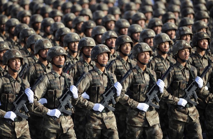 Soldiers from Chinese People's Liberation Army (PLA) Special Operations Forces march in formation during a training session at the 60th National Day Parade Village on the outskirts of Beijing in this September 15, 2009 file photo. China will beef up its military budget by 12.7 percent this year, the government said on March 4, 2011, a return to double-digit spending increases that will stir regional unease. REUTERS/Joe Chan/Files (CHINA - Tags: MILITARY) CHINA OUT. NO COMMERCIAL OR EDITORIAL SALES IN CHINA