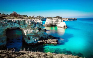 idyllic-shot-of-rock-formation-in-sea-at-salento-against-sky-611458547-5bdb6e3cc9e77c0026d4409b